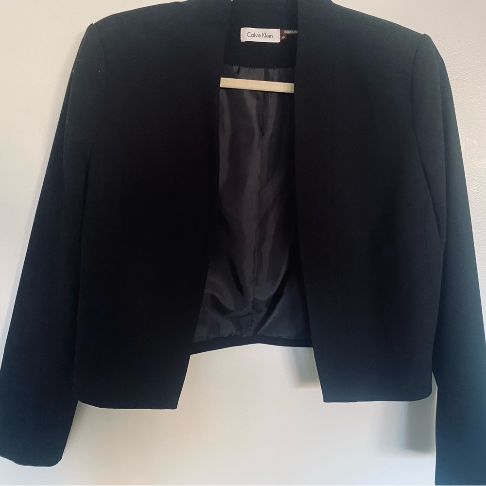 Cropped black jacket by Calvin Klein. Excellent condition.
